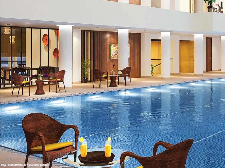 Tata Avenida swimming pool with deck seating luxury amenities Kolkata